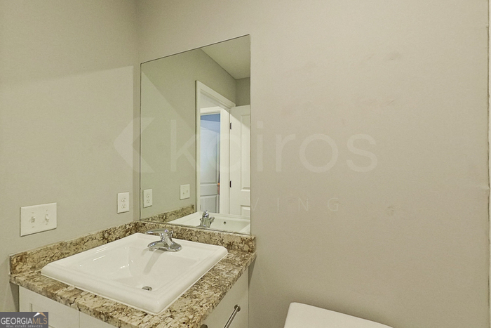 132 Cottage Grove Road Brunswick, GA 31525 - Photo 8 of 17 a bathroom with a sink and a mirror