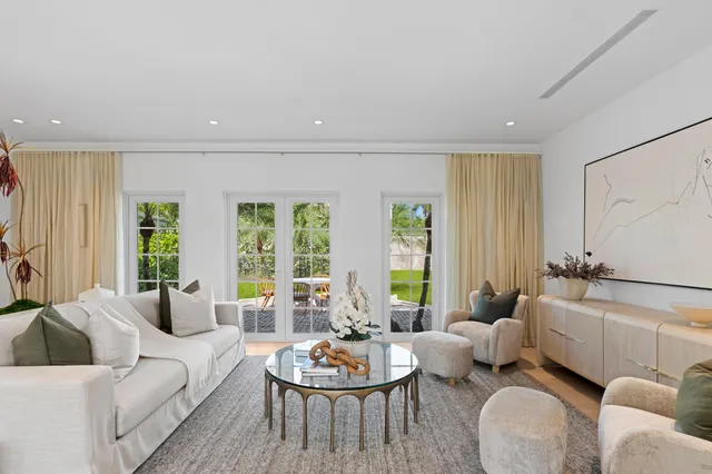 a bedroom with a bed and a flat screen tv on the dresser