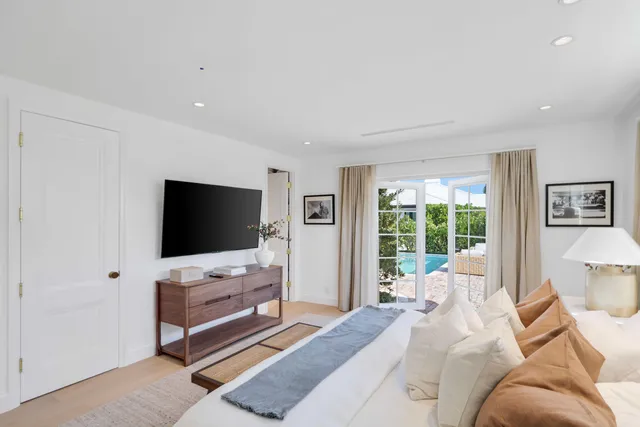 a bathroom with a toilet sink and shower curtain