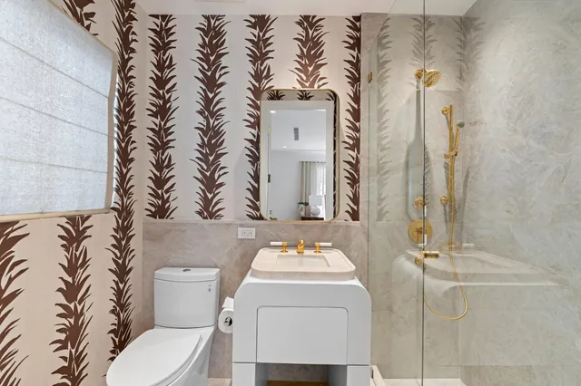 an aerial view of a house with garden space and street view