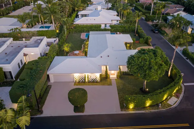 a view of a backyard with plants and a patio