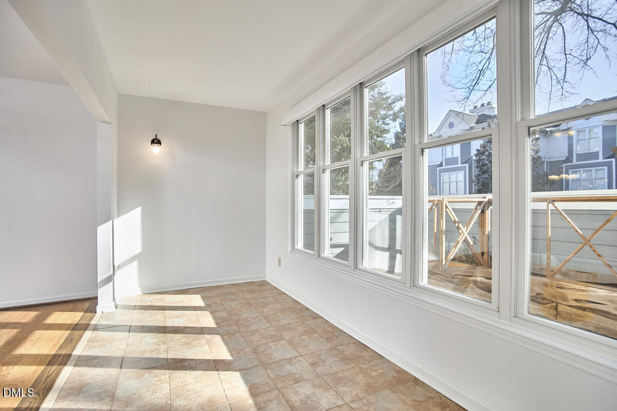720 Bishops Park Drive, Unit 101 Raleigh, NC 27605 - Photo 13 of 26 13 - Sunroom