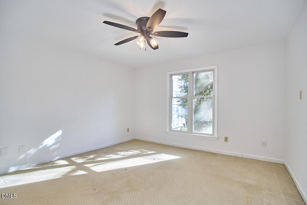 720 Bishops Park Drive, Unit 101 Raleigh, NC 27605 - Photo 14 of 26 14 - Primary Bedroom