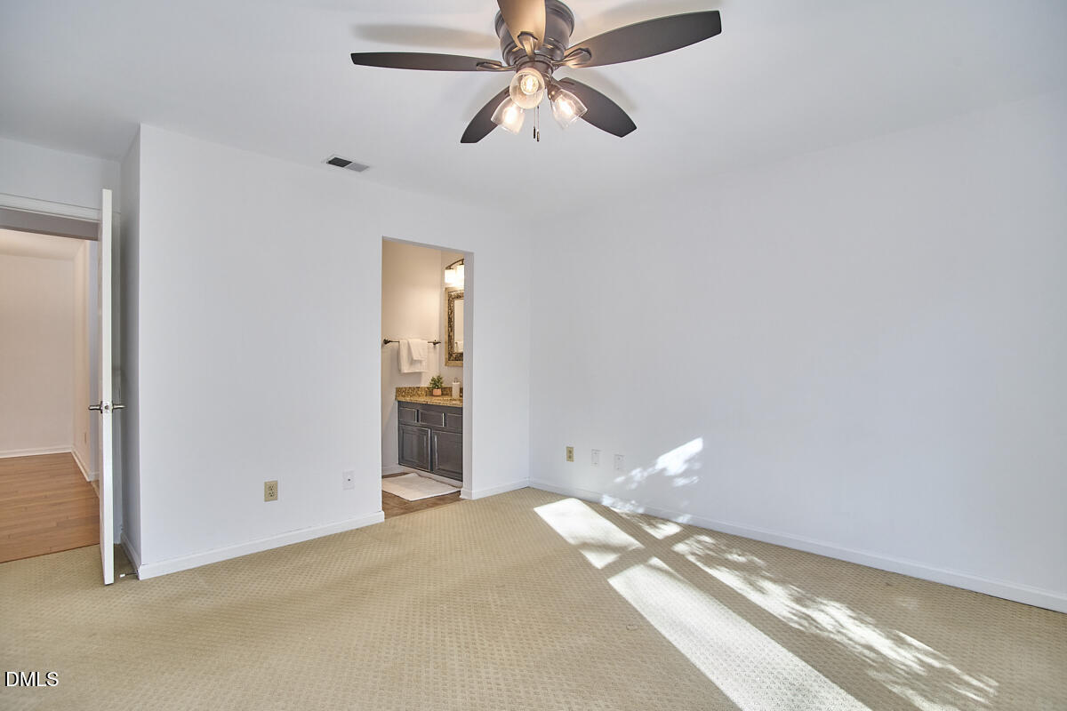 720 Bishops Park Drive, Unit 101 Raleigh, NC 27605 - Photo 15 of 26 15 - Primary Bedroom