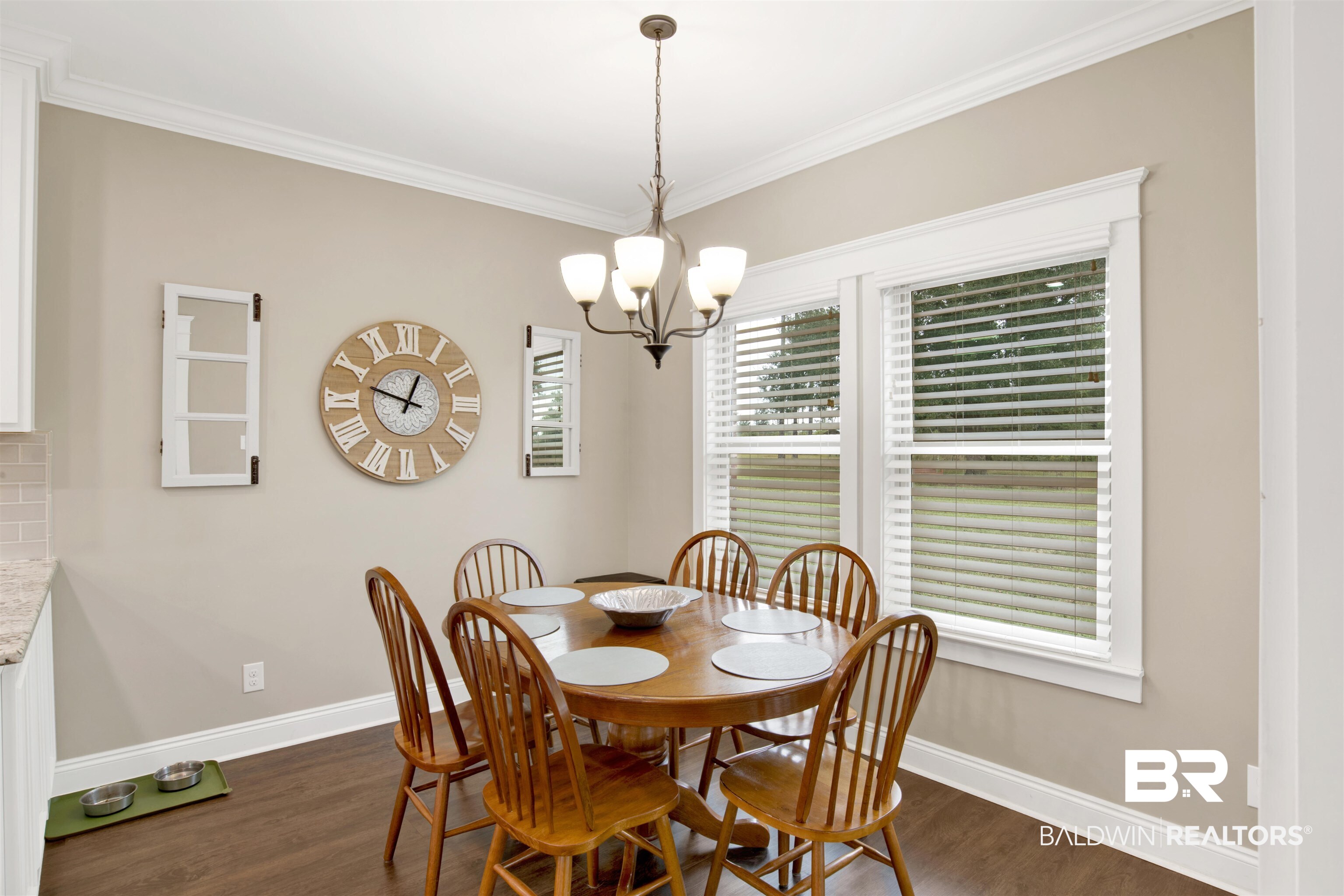 2440 Johnson Road West Mobile, AL 36695 - Photo 13 of 40 Dining room with a chandelier, dark hardwood / wood-style floors, and ornamental molding