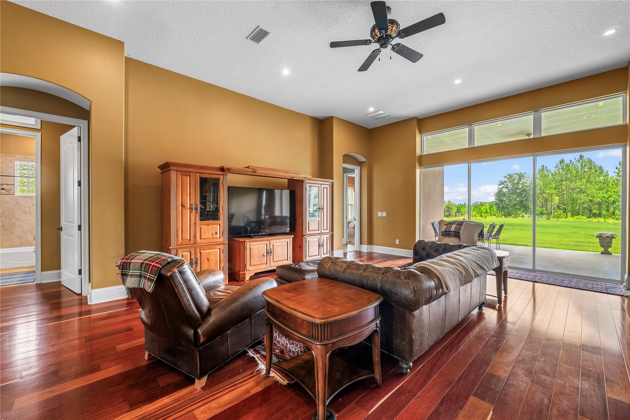 27247 Hallman Road Hilliard, FL 32046 - Photo 17 of 59 a living room with furniture and a large window