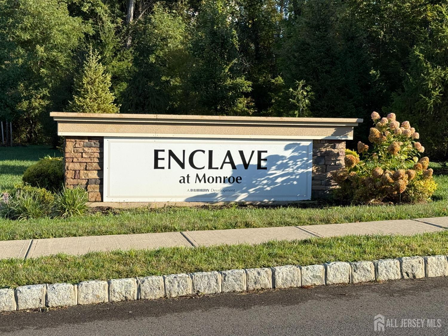 a view of outdoor space with signage and flags