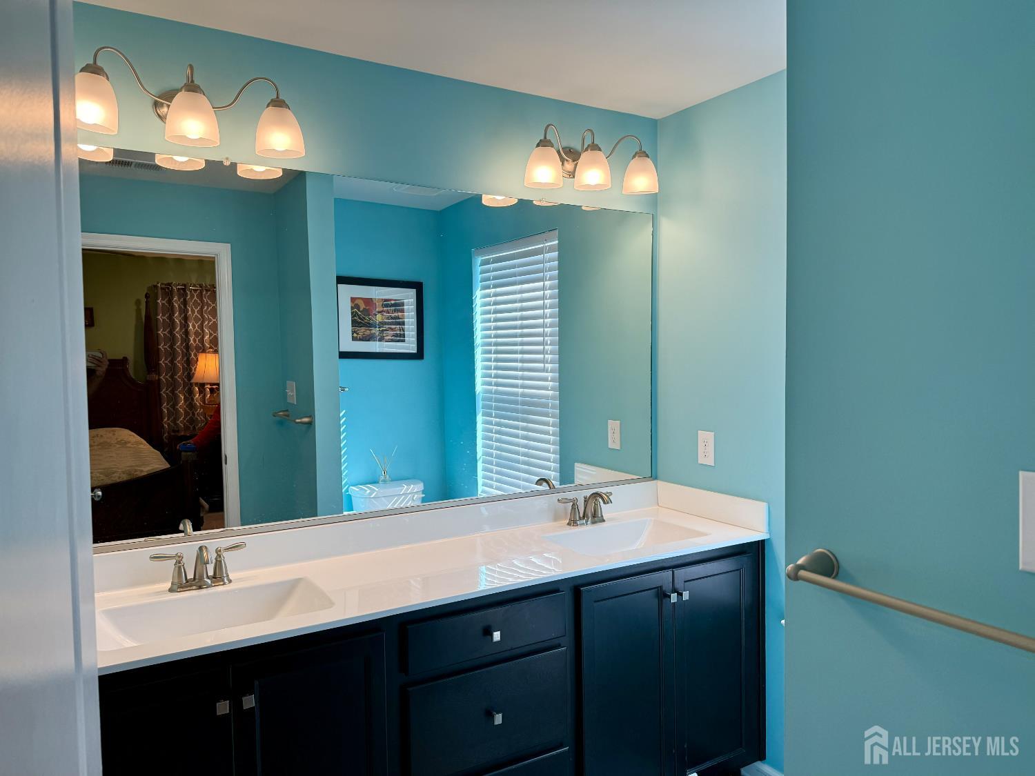 301 Matutina Road Monroe Township, NJ 08831 - Photo 17 of 42 a bathroom with a double vanity sink and a mirror