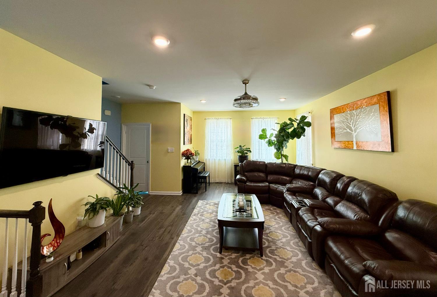 301 Matutina Road Monroe Township, NJ 08831 - Photo 25 of 42 a living room with furniture and a flat screen tv