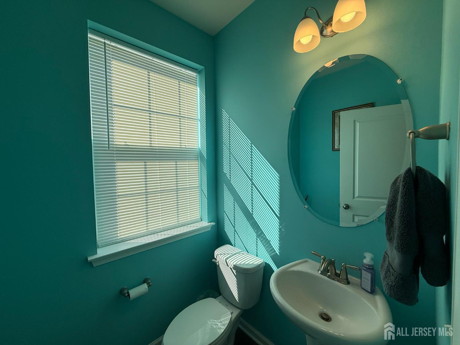 301 Matutina Road Monroe Township, NJ 08831 - Photo 27 of 42 a bathroom with a sink and a mirror