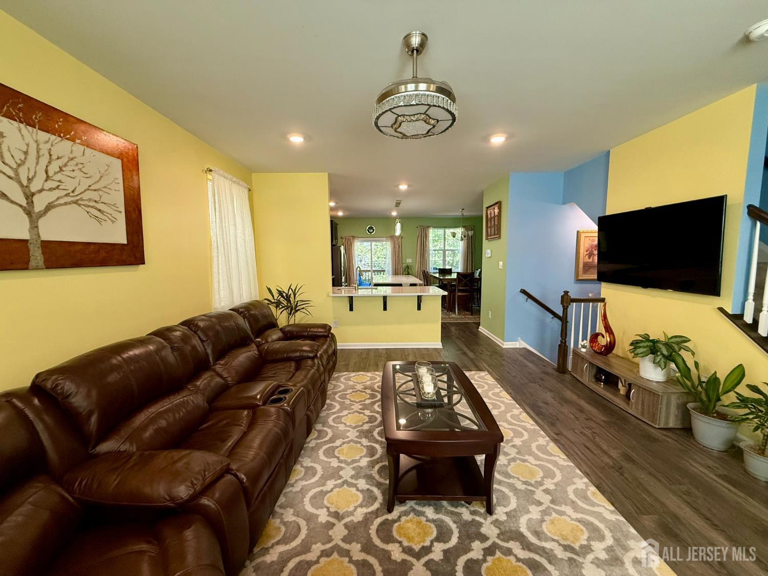 301 Matutina Road Monroe Township, NJ 08831 - Photo 28 of 42 a living room with furniture and a flat screen tv