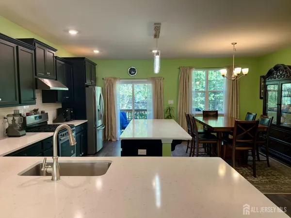 a kitchen with refrigerator cabinets and furniture