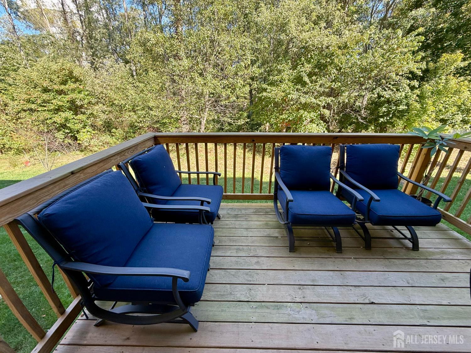 301 Matutina Road Monroe Township, NJ 08831 - Photo 38 of 42 a balcony with wooden benches and a couch