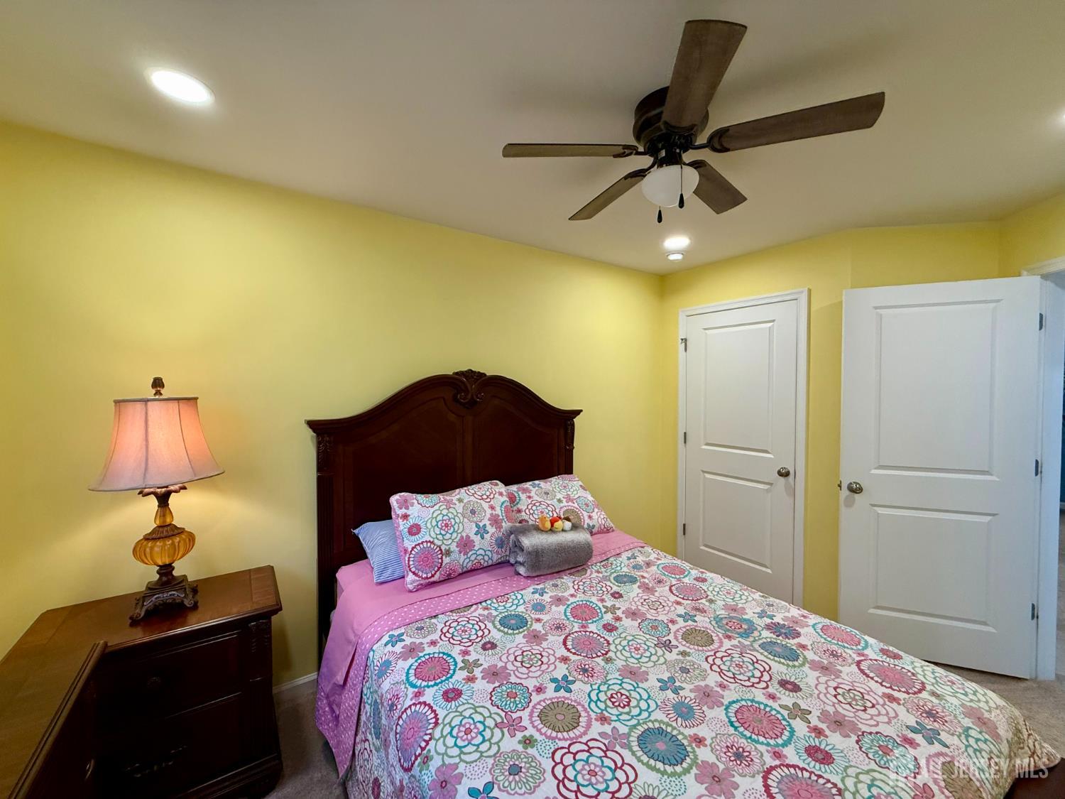 301 Matutina Road Monroe Township, NJ 08831 - Photo 10 of 42 a bedroom with a bed and a lamp