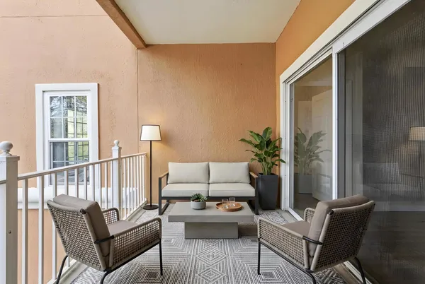 a bedroom with a bed and glass window