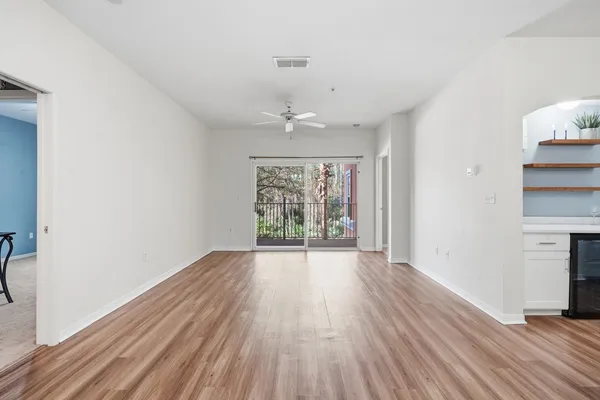 a view of walk in closet with empty racks
