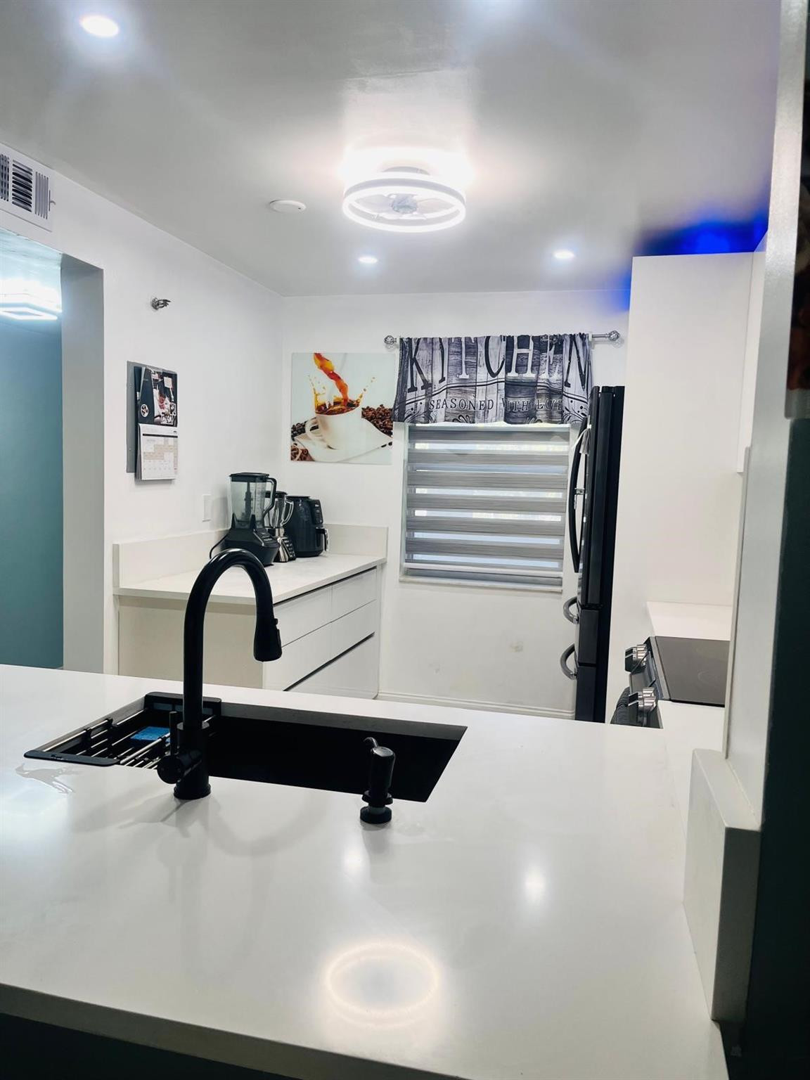 3910 Inverrary Boulevard, Unit 203B Lauderhill, FL 33319 - Photo 16 of 61 a view of kitchen with a sink and a refrigerator