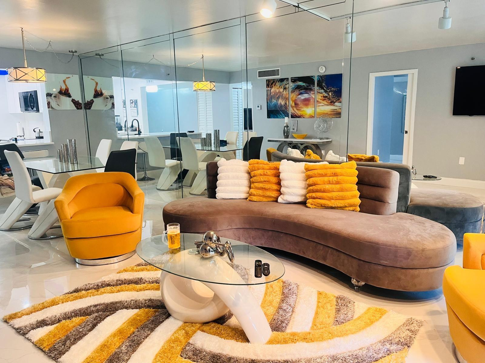 3910 Inverrary Boulevard, Unit 203B Lauderhill, FL 33319 - Photo 23 of 61 a living room with furniture and a flat screen tv