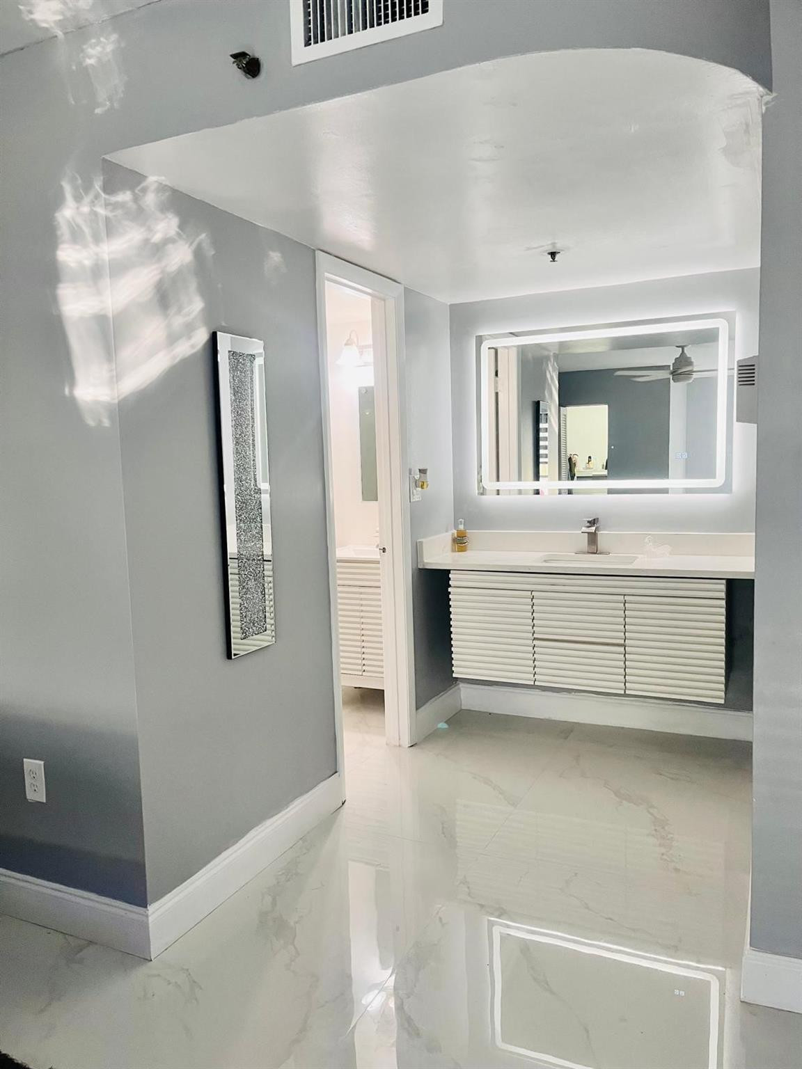 3910 Inverrary Boulevard, Unit 203B Lauderhill, FL 33319 - Photo 30 of 61 a view of living room with granite countertop furniture and a fireplace
