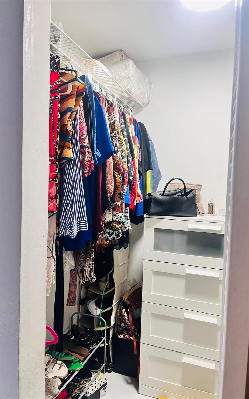 3910 Inverrary Boulevard, Unit 203B Lauderhill, FL 33319 - Photo 36 of 61 a view of walk in closet with clothes and shoes