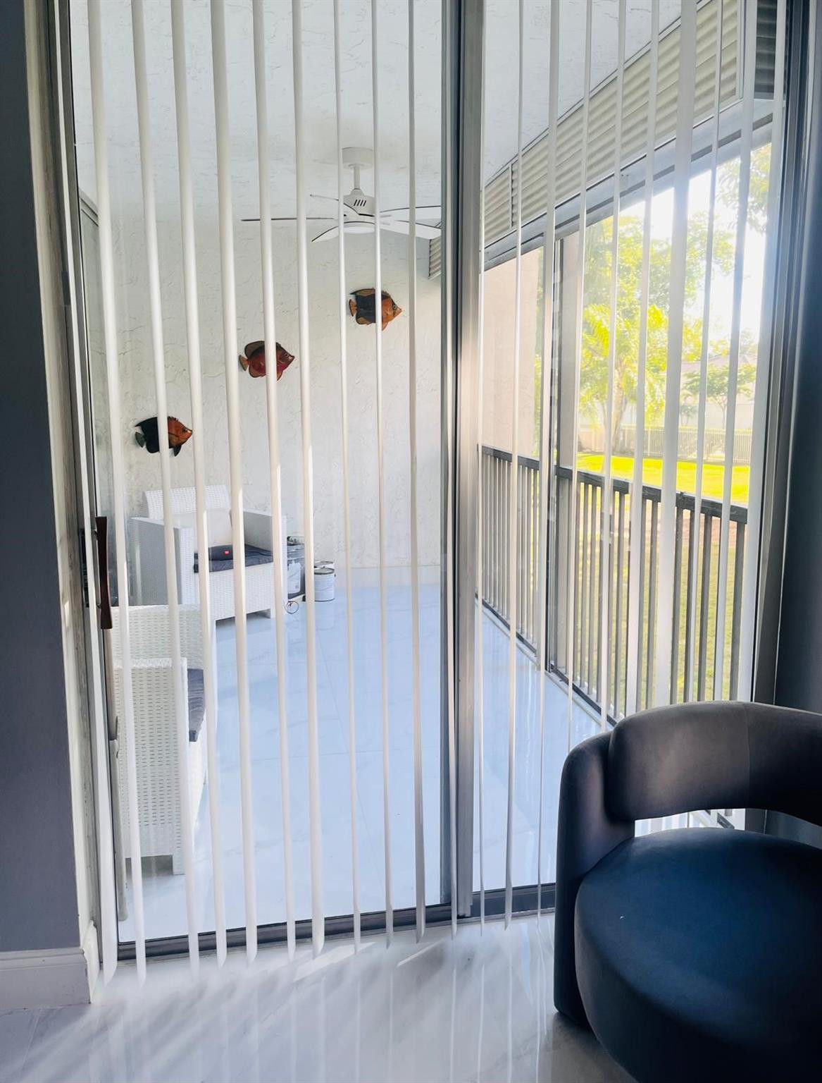 3910 Inverrary Boulevard, Unit 203B Lauderhill, FL 33319 - Photo 39 of 61 a living room with furniture and a window