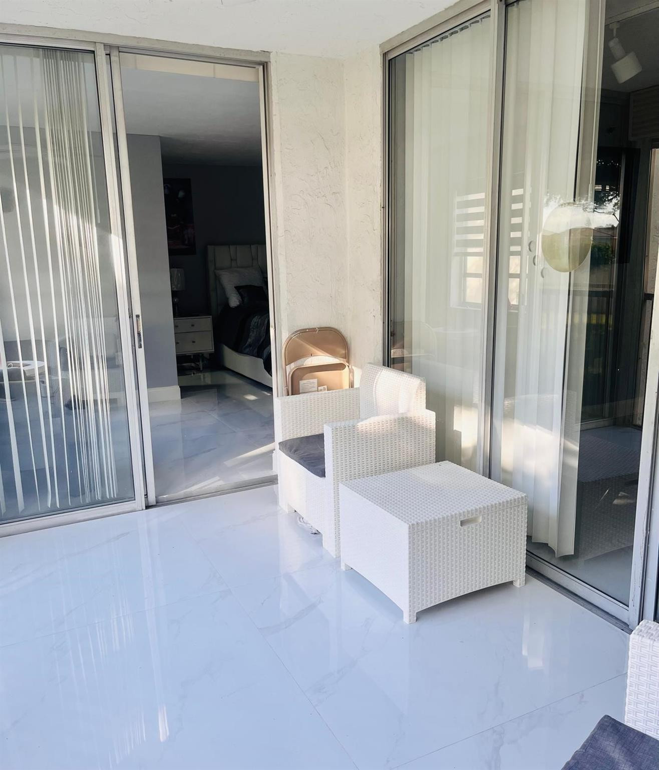 3910 Inverrary Boulevard, Unit 203B Lauderhill, FL 33319 - Photo 41 of 61 a bedroom with a bed and a mirror