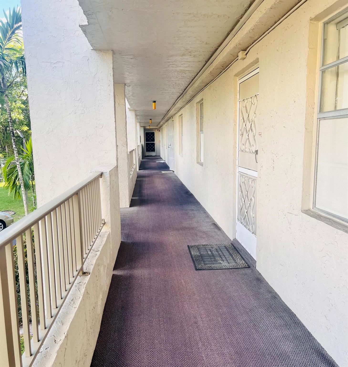 3910 Inverrary Boulevard, Unit 203B Lauderhill, FL 33319 - Photo 45 of 61 a view of a hallway with wooden floor and staircase