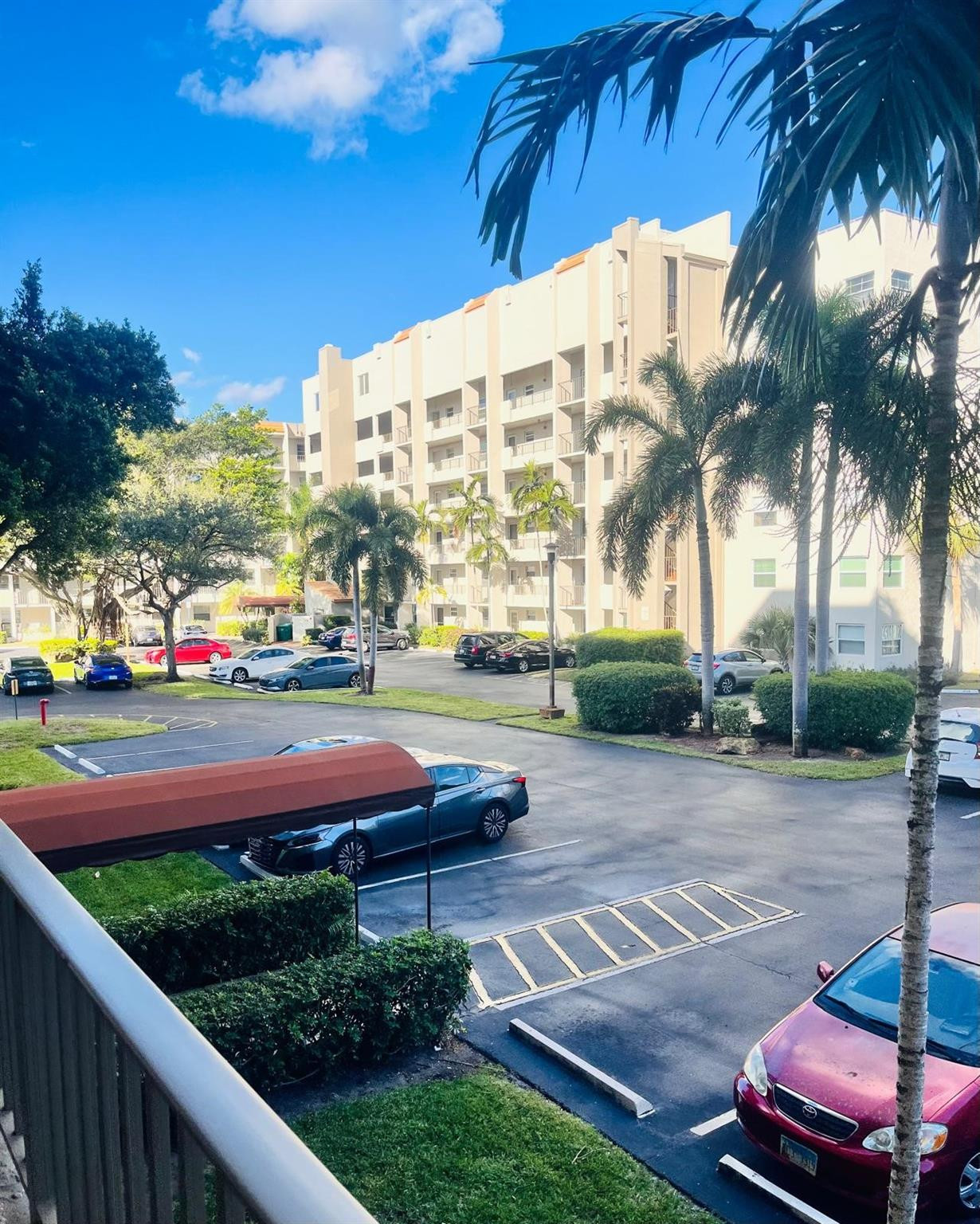 3910 Inverrary Boulevard, Unit 203B Lauderhill, FL 33319 - Photo 54 of 61 a view of a yard with cars