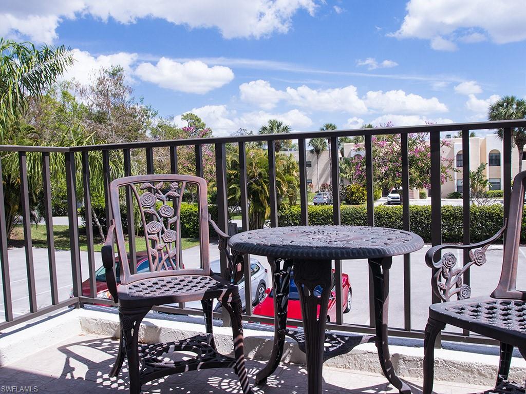 3321 Olympic Drive, Unit 623 Naples, FL 34105 - Photo 10 of 20 a view of a chairs and table in the balcony