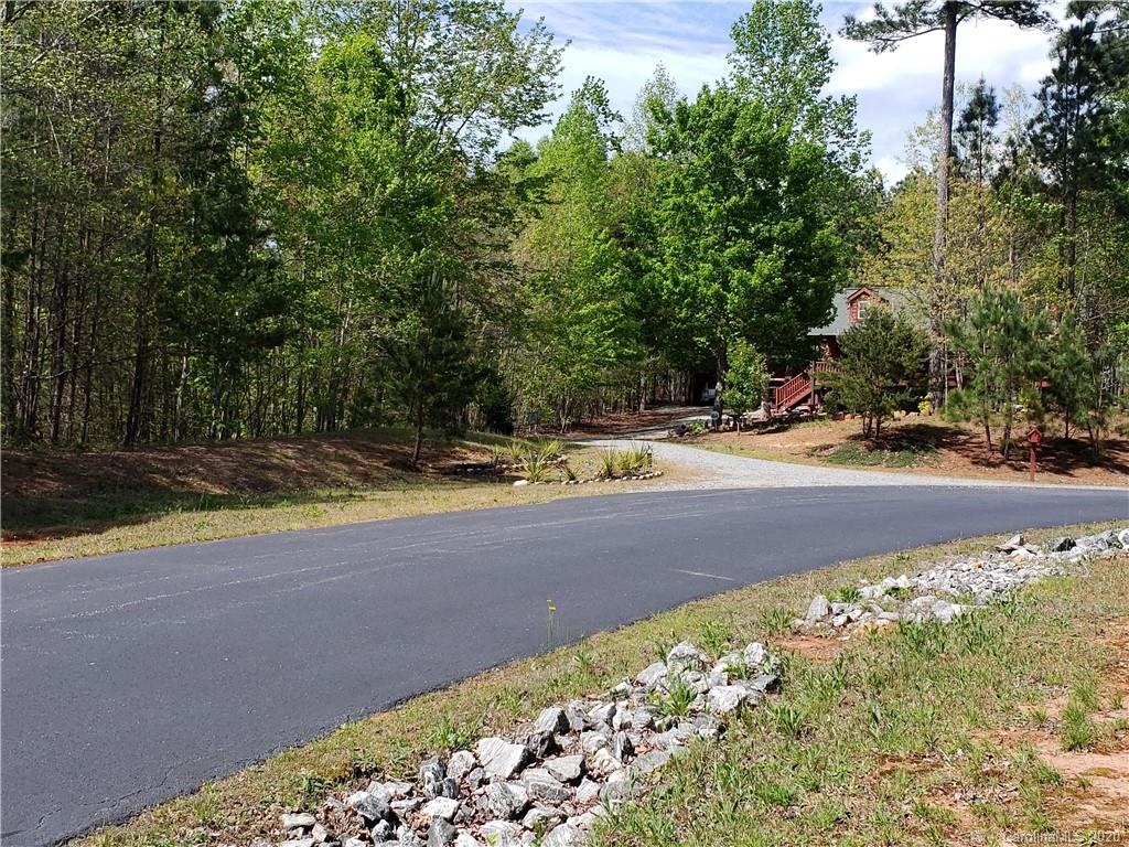 0 Rock Ridge Rd Mill Spring, Unit 2 Mill Spring, NC 28756 - Photo 12 of 12 a view of yard with large trees and plants