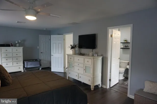 a room with a bed and furniture