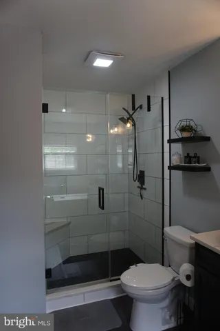 a room with gym equipment and a flat screen tv