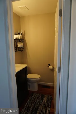 a bathroom with a toilet and a sink
