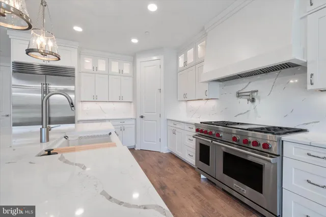 a utility room with sink dryer and washer