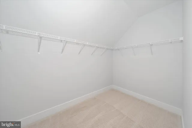 a white toilet sitting next to a bath tub