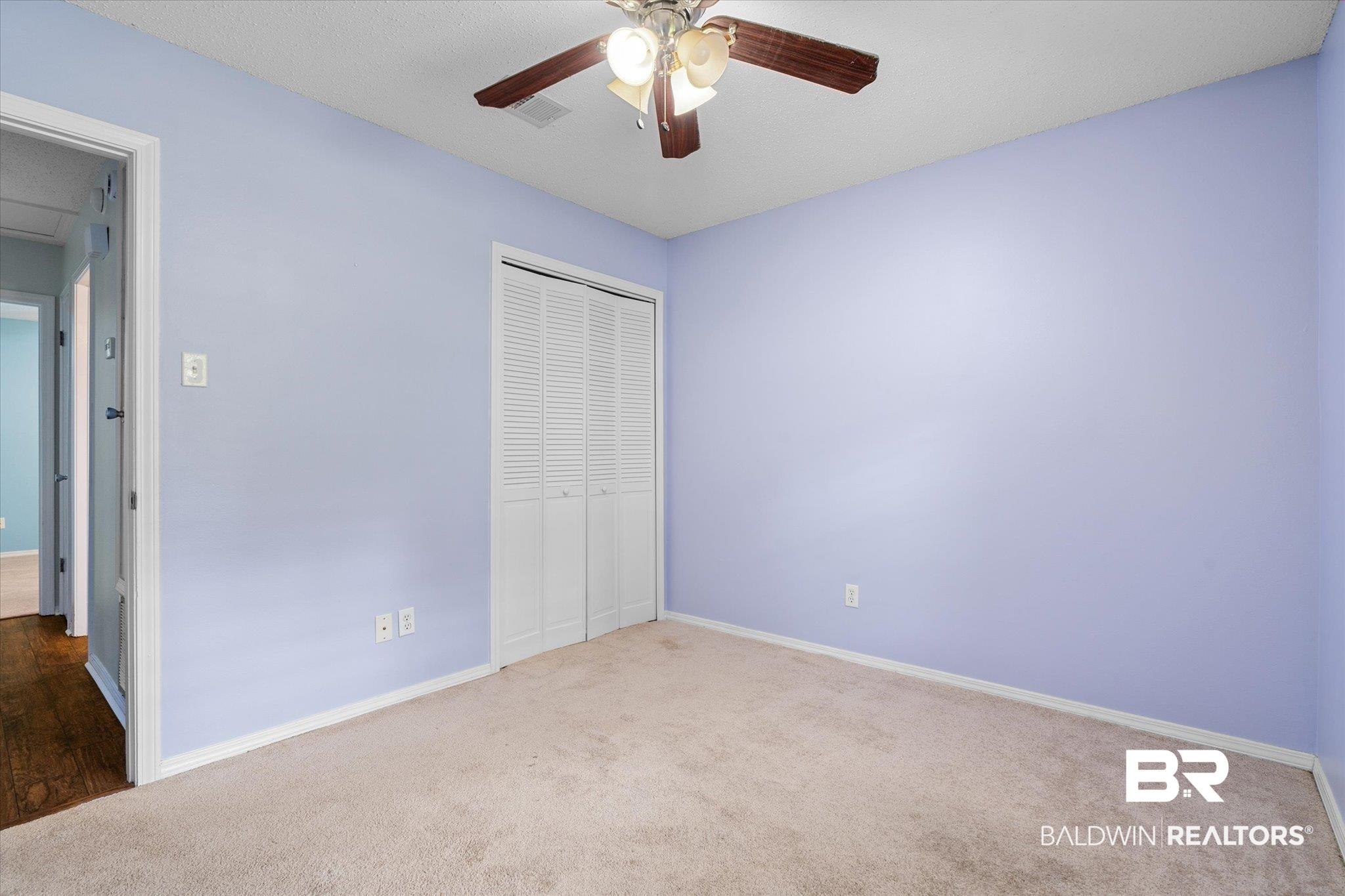 5645 Green Tree Road Mobile, AL 36609 - Photo 14 of 30 Unfurnished bedroom featuring carpet floors, a closet, baseboards, and ceiling fan
