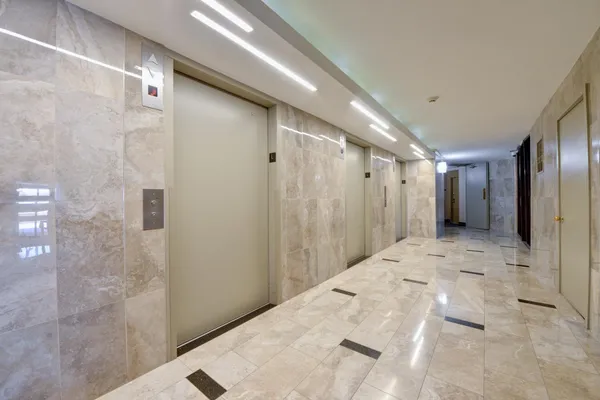 a bathroom with a shower and a sink