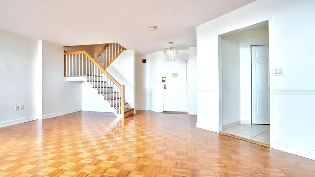 a view of an entryway with wooden floor