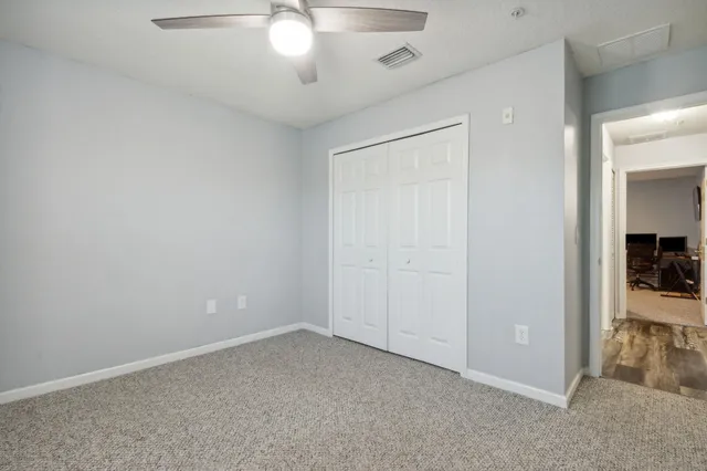an empty room with fan