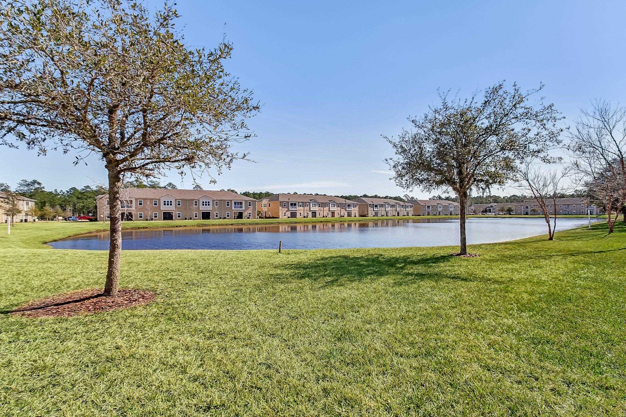 404 Golden Lake Loop St. Augustine, FL 32084 - Photo 33 of 38 a view of a field with large trees
