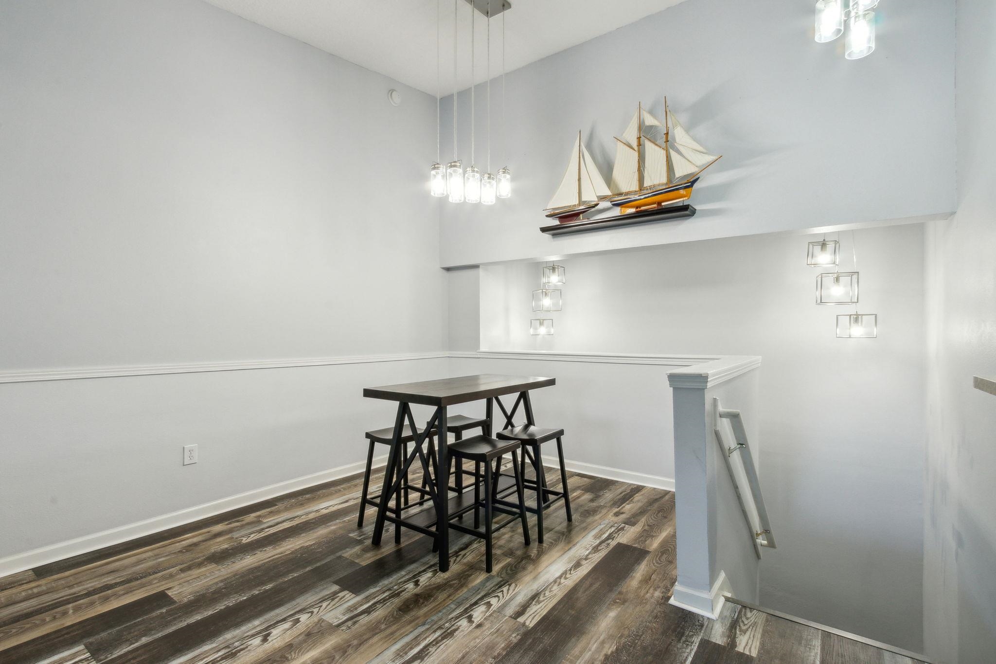 404 Golden Lake Loop St. Augustine, FL 32084 - Photo 8 of 38 a view of dining room and wooden floor