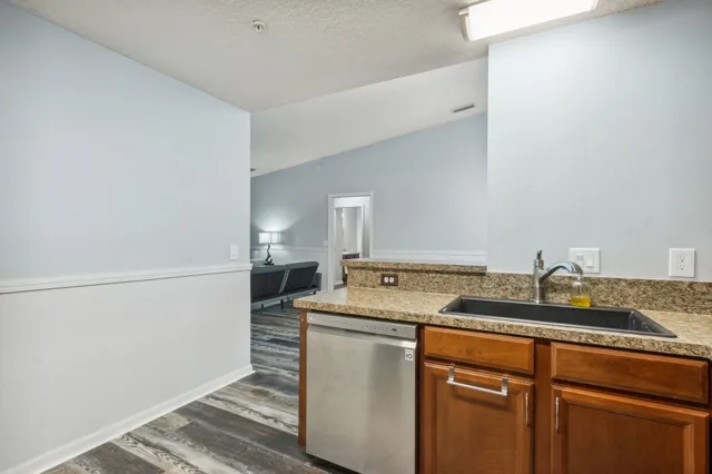 a utility room with faucet washer and dryer