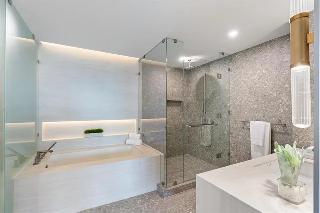 a bathroom with a bathtub and a sink