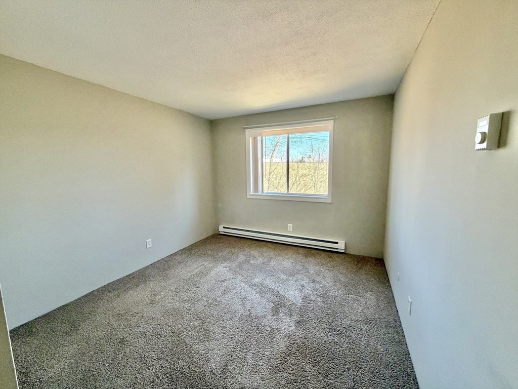 800 County Street, Unit 23 Taunton, MA 02780 - Photo 12 of 20 an empty room with a window