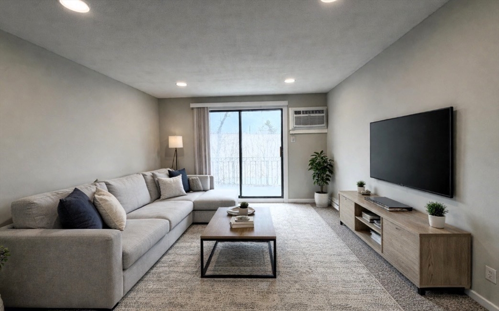 800 County Street, Unit 23 Taunton, MA 02780 - Photo 5 of 20 a living room with furniture and a flat screen tv
