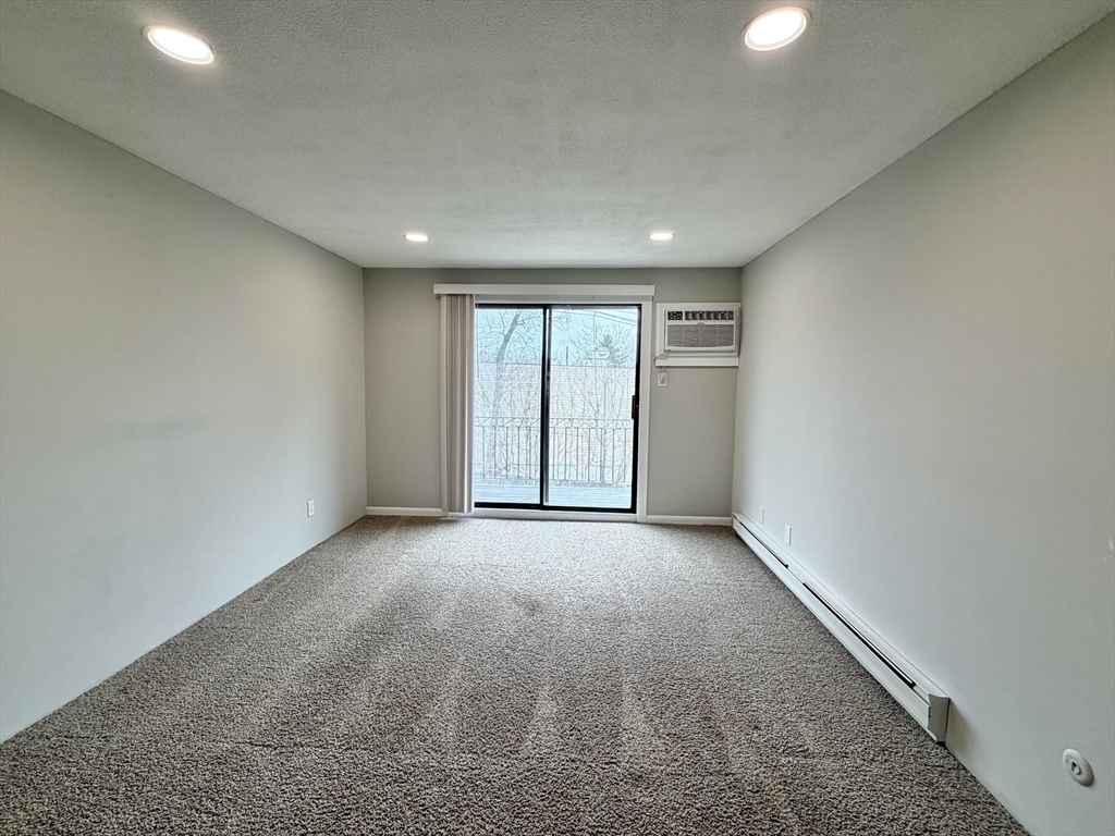 800 County Street, Unit 23 Taunton, MA 02780 - Photo 6 of 20 an empty room with windows