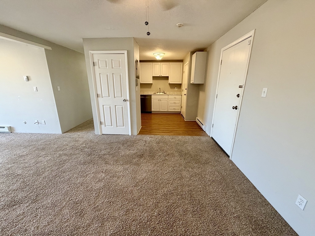 800 County Street, Unit 23 Taunton, MA 02780 - Photo 7 of 20 a view of a hallway with wooden floors
