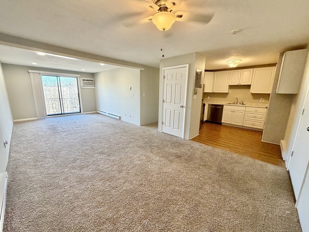 800 County Street, Unit 23 Taunton, MA 02780 - Photo 8 of 20 a view of livingroom with hardwood floor and a ceiling fan