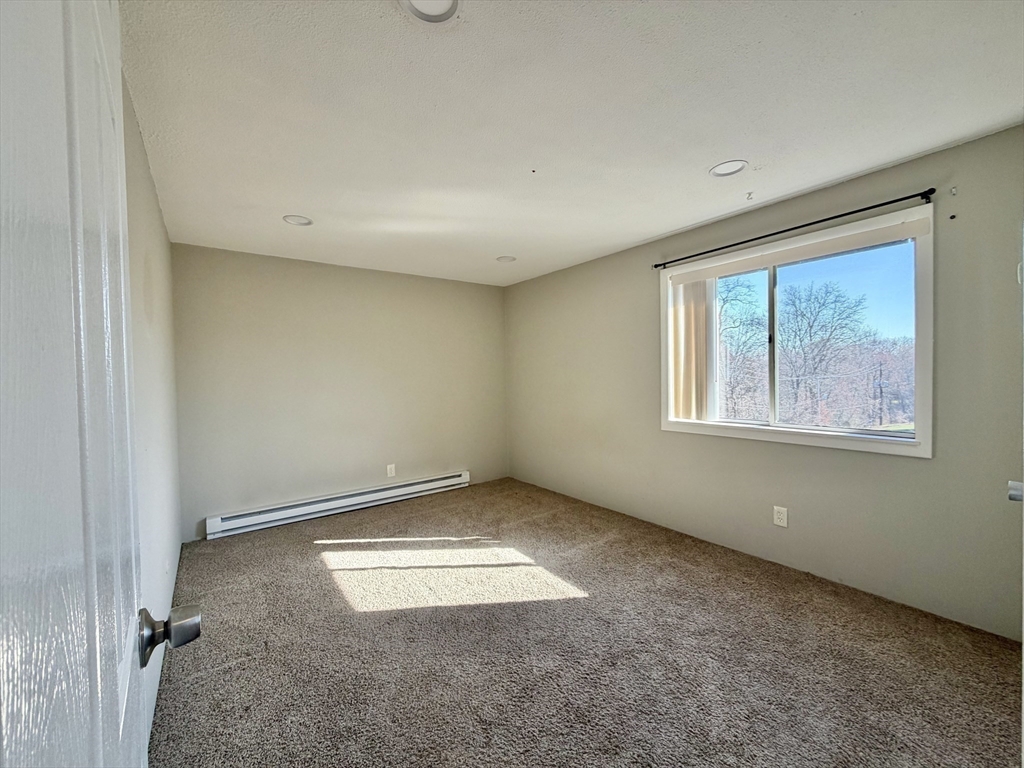 800 County Street, Unit 23 Taunton, MA 02780 - Photo 10 of 20 an empty room with windows