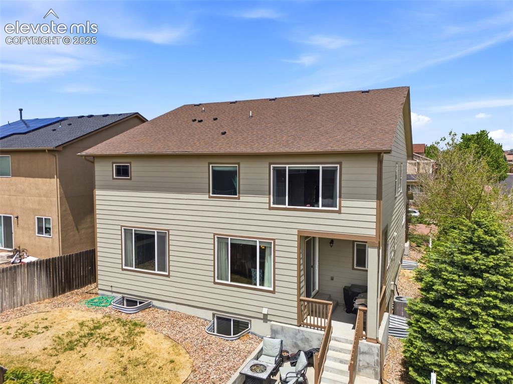 2264 Reed Grass Way Colorado Springs, CO 80915 - Photo 45 of 50 a view of a house with a backyard